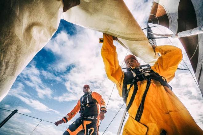 Onboard Team Alvimedica - Dave Swete pulls down the fractional code zero after a sail change with the help of Charlie Enright - Leg five to Itajai -  Volvo Ocean Race 2015 ©  Amory Ross / Team Alvimedica